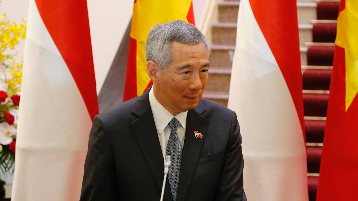 Singapore Prime Minister Lee Hsien Loong speaks during a joint press briefing with his Vietnamese counterpart Nguyen Xuan Phuc in Hanoi, Vietnam, Thursday, March 23, 2017. Lee is on a four-day visit to Vietnam to boost bilateral ties. (AP Photo/Tran Van Minh)