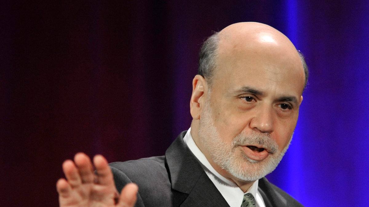 Federal Reserve Chairman Ben Bernanke waves