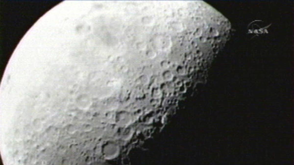 This image provided by NASA shows the first image taken of the moon from the Lunar Crater Observation and Sensing Satellite Friday morning Oct. 9, 2009. Two NASA spacecraft are barreling toward the moon at twice the speed of a bullet, about to crash into a lunar crater in a search for ice. (AP Photo/NASA)