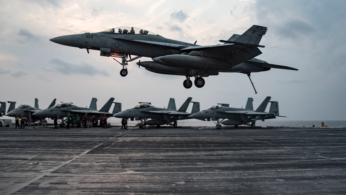 161124-N-KK394-671ARABIAN GULF (Nov. 24, 2016) An F/A-18 F Super Hornet assigned to the Fighting Swordsmen of Strike Fighter Squadron (VFA) 32 prepares to make an arrested landing on the flight deck of the aircraft carrier USS Dwight D. Eisenhower (CVN 69) (Ike). Ike and its carrier strike group are deployed in support of Operation Inherent Resolve, maritime security operations and theater security cooperation efforts in the U.S. 5th Fleet area of operations. (U.S. Navy photo by Petty Officer 3rd Class Anderson W. Branch)