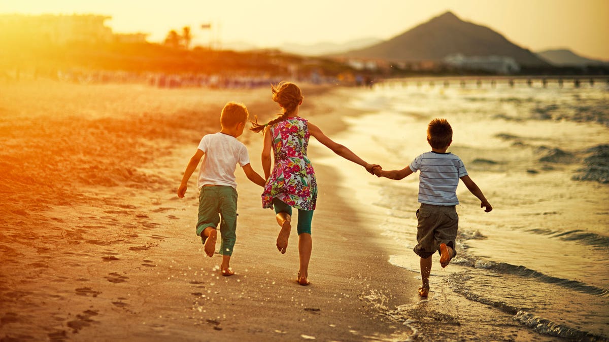 family beach vacation istock