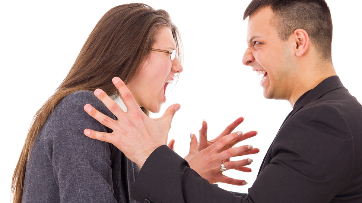 angry couple fighting wanting to strange each other