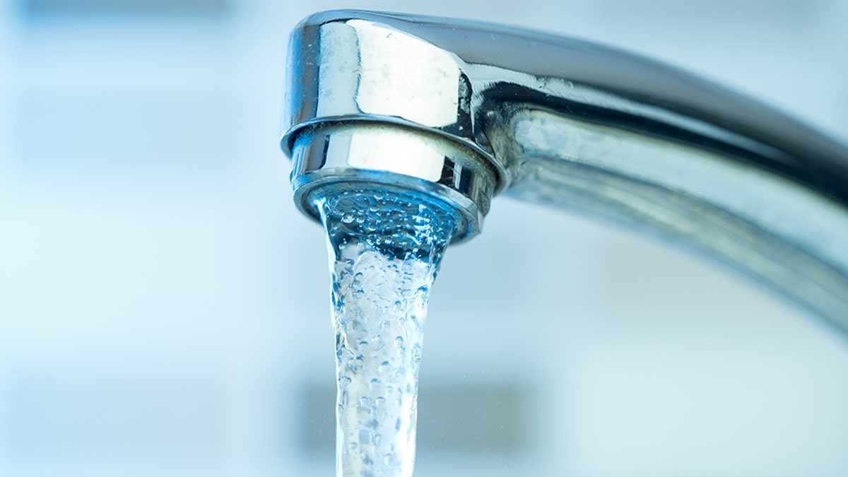 Pouring water from a Faucet high quality and high resolution studio