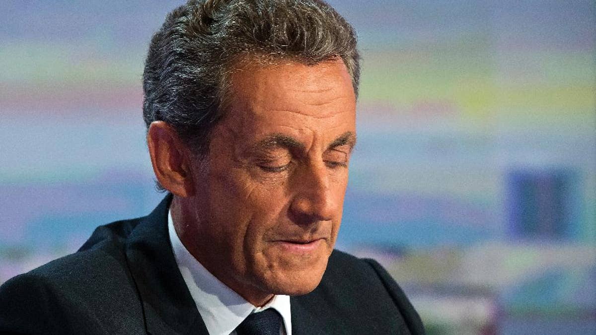 FILE - In this Aug. 24, 2016. file photo, former French President Nicolas Sarkozy, closes his eyes prior to a televised interview in Boulogne-Billancourt, outside Paris. A Paris prosecutor has requested Monday Sept.5, 2016 a criminal trial for former President Nicolas Sarkozy over suspected illegal overspending on his failed 2012 re-election campaign. (AP Photo/Michel Euler, File)