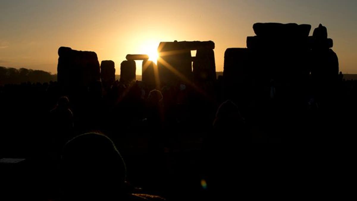 Dec. 21, 2012: The sun passes through the stones after rising at the ancient stone circle of Stonehenge, in southern England, as access to the site is given to druids, New Age followers and members of the public on the annual Winter Solstice.