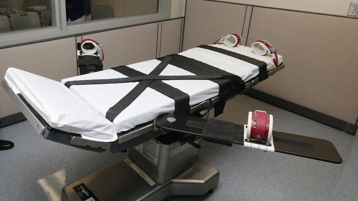 FILE - This Oct. 9, 2014 file photo shows the gurney in the the execution chamber at the Oklahoma State Penitentiary in McAlester, Okla. Oklahoma has had one of the busiest death chambers in the country for decades, executing more people per capita than any other state since the U.S. Supreme Court ruled in 1976 that death sentences could resume. But after a botched lethal injection in 2014 and drug mix-ups in two scheduled executions in 2015, the state is taking a close look at whether executions should resume at all (AP Photo/Sue Ogrocki, File)