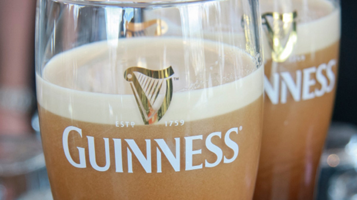 Dublin, Ireland - June 19, 2008: Two pints of beer served at The Guinness Brewery, founded by Arthur Guinness in 1759, where 2.5 million pints of stout are brewed daily