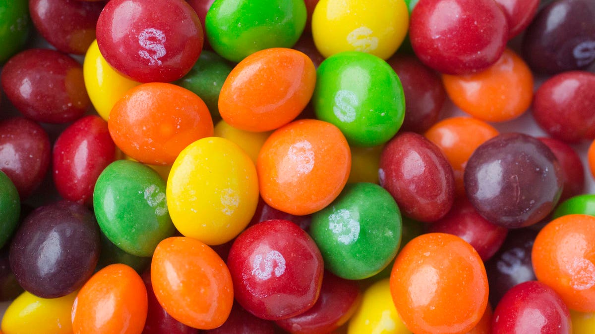 This Wednesday, June 1, 2016, photo shows Skittles, in New York. The Associated Press takes a look at how candy, cookie and soda makers are shaping nutrition science. Critics say industry-funded research is marketing masquerading as science, but the findings nevertheless become a part of the scientific literature. (AP Photo/Mark Lennihan)