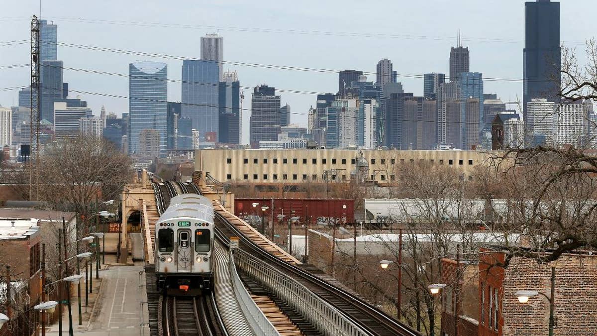 A Chicago Transit Authority Green Line train travels West away from downtown Chicago, Thursday, March 23, 2017, in Chicago. Census data shows the Chicago region has lost more residents than any other U.S. metropolitan area, a drop that comes as other Midwestern cities lost population and South and Southwest parts of the country saw gains. (AP Photo/Charles Rex Arbogast)