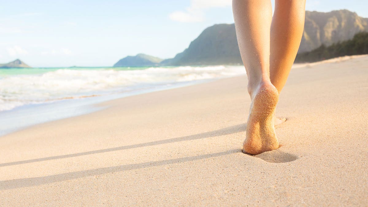 feet female beach istock