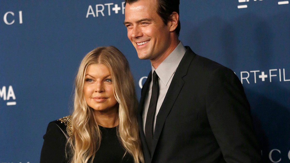 Actor Josh Duhamel and singer Fergie pose at the Los Angeles County Museum of Art (LACMA) 2013 Art+Film Gala in Los Angeles, California November 2, 2013.