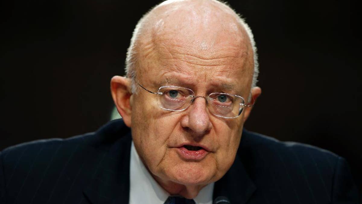 FILE - In this Feb. 9, 2016 file photo, Director of the National Intelligence James Clapper testifies on Capitol Hill in Washington. Even though bulk collection of Americans’ phone records has ended, calls and emails are still being swept up by U.S. surveillance work targeting foreigners. There is a renewed push to find out how many. (AP Photo/Alex Brandon, File)