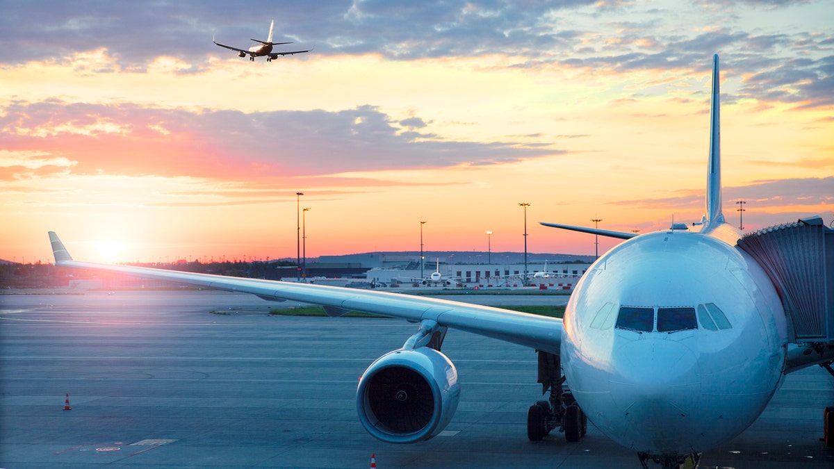 Charles De Gaulle , International airport in Paris - Airplane at sunrise.