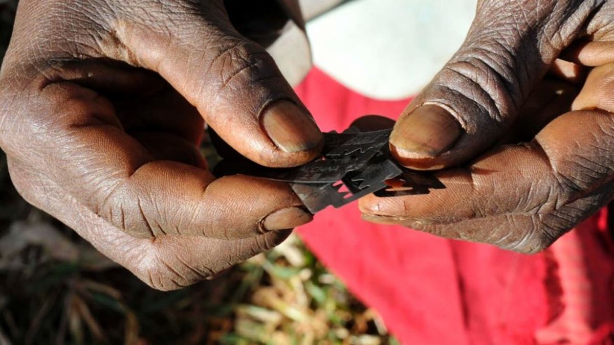 Razor blades often used before carrying out female genital mutilation. (REUTERS/James Akena)