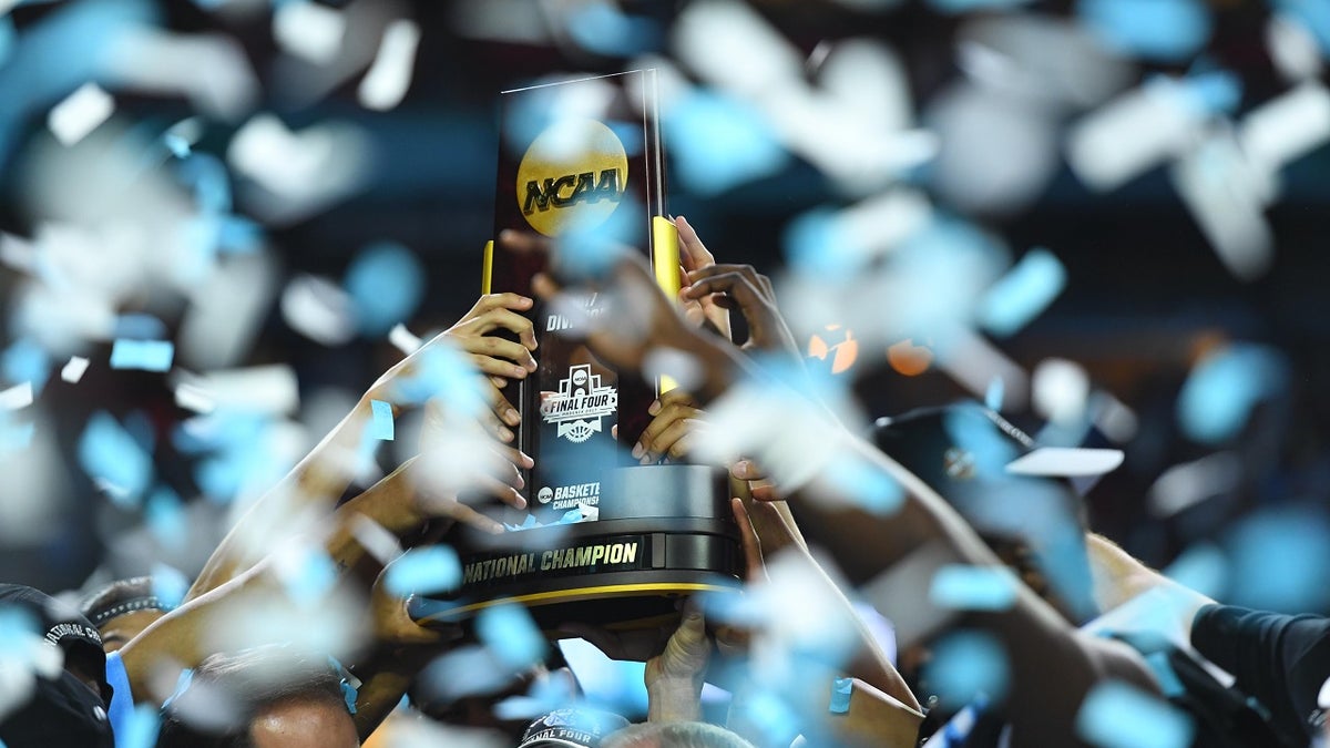 Apr 3, 2017; Phoenix, AZ, USA; North Carolina Tar Heels players hoist the national championship trophy after defeating the Gonzaga Bulldogs in the championship game of the 2017 NCAA Men's Final Four at University of Phoenix Stadium. Mandatory Credit: Bob Donnan-USA TODAY Sports - 9992205