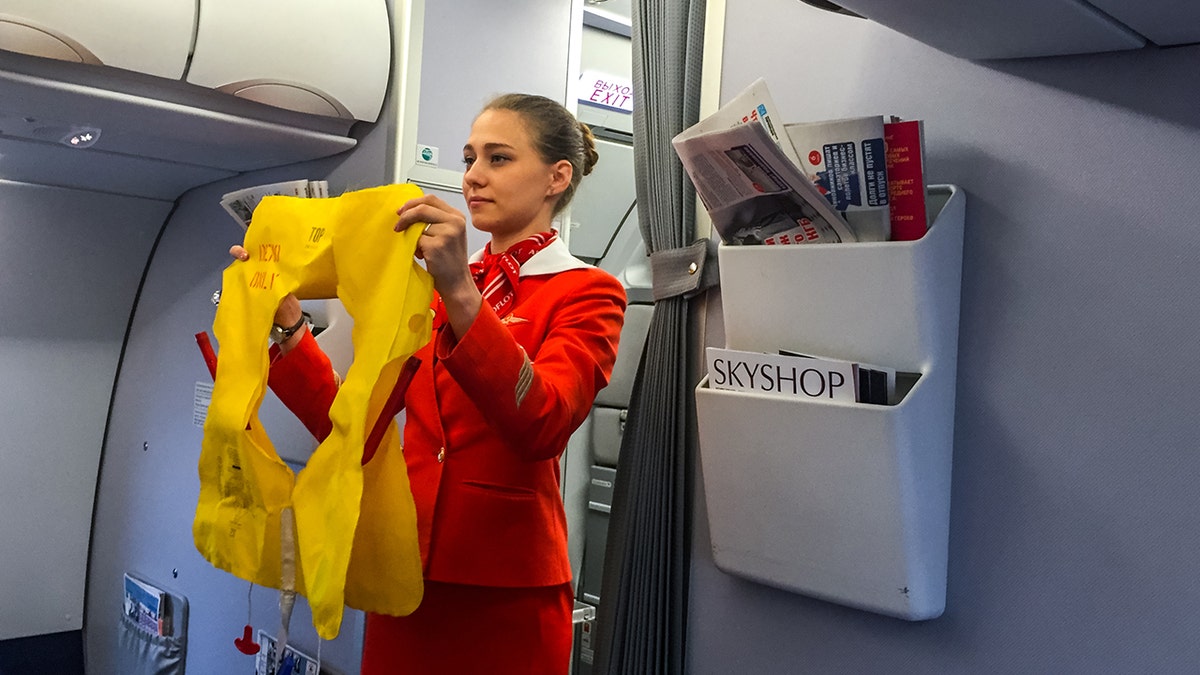 flight attendant making announcement