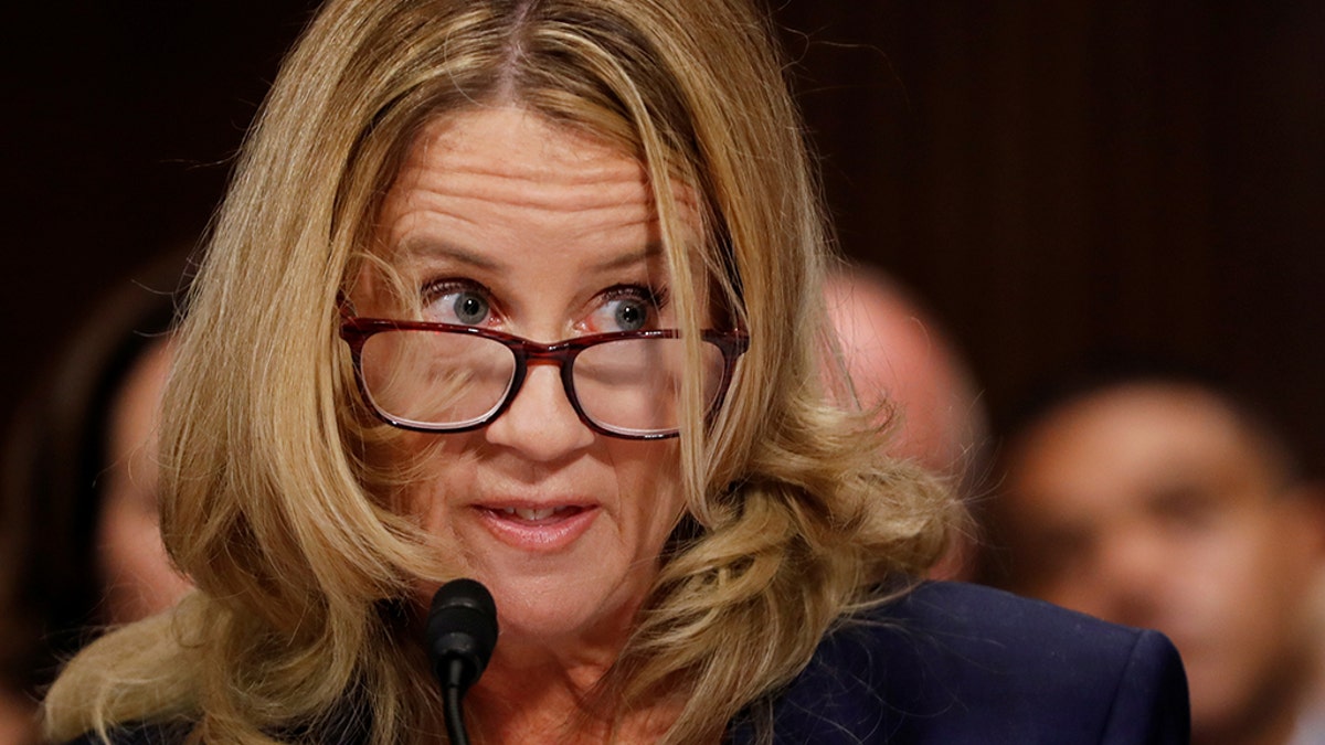 Professor Christine Blasey Ford, who has accused U.S. Supreme Court nominee Brett Kavanaugh of a sexual assault in 1982, listens while testifying before a Senate Judiciary Committee confirmation hearing for Kavanaugh on Capitol Hill in Washington, U.S., September 27, 2018. REUTERS/Jim Bourg - RC169422F7B0