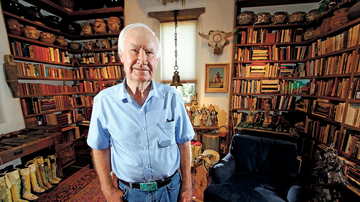 In this July 4, 2014 photo, Forrest Fenn poses at his Santa Fe, N.M., home. New Mexico's top law enforcement officer is asking Fenn, the author and antiquities dealer who inspired thousands to comb remote corners of the West in vain for a chest of gold and jewels to end the treasure hunt. The plea from New Mexico State Police Chief Pete Kassetas follows what authorities believe is the latest death related to the hunt for Fenn's hidden treasure. (Luis Sanchez Saturno/Santa Fe New Mexican via AP)