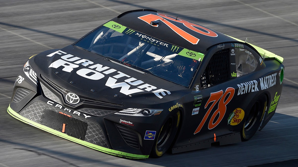 FILE - In this Oct. 1, 2017, file photo, Martin Truex Jr. competes during the NASCAR Cup Series auto race, at Dover International Speedway in Dover, Del. Furniture Row Racing will cease operations at the end of this season, shutting its doors one year after Martin Truex Jr. won NASCARâs championship driving for the maverick race team. Furniture Row is an anomaly in NASCAR in that it is a single-car team based in Denver, Colorado, far removed from the North Carolina hub. Team owner Barney Visser was a racing enthusiast with a vision when he launched the team in 2005 determined to do it his own way. But a lack of sponsorship for next season led Visser to make the âpainful decisionâ to close the team. (AP Photo/Nick Wass, File)