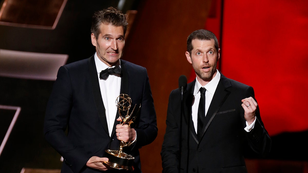 David Benioff (L) and D.B. Weiss accept the award for Outstanding Writing For A Drama Series for HBO's 