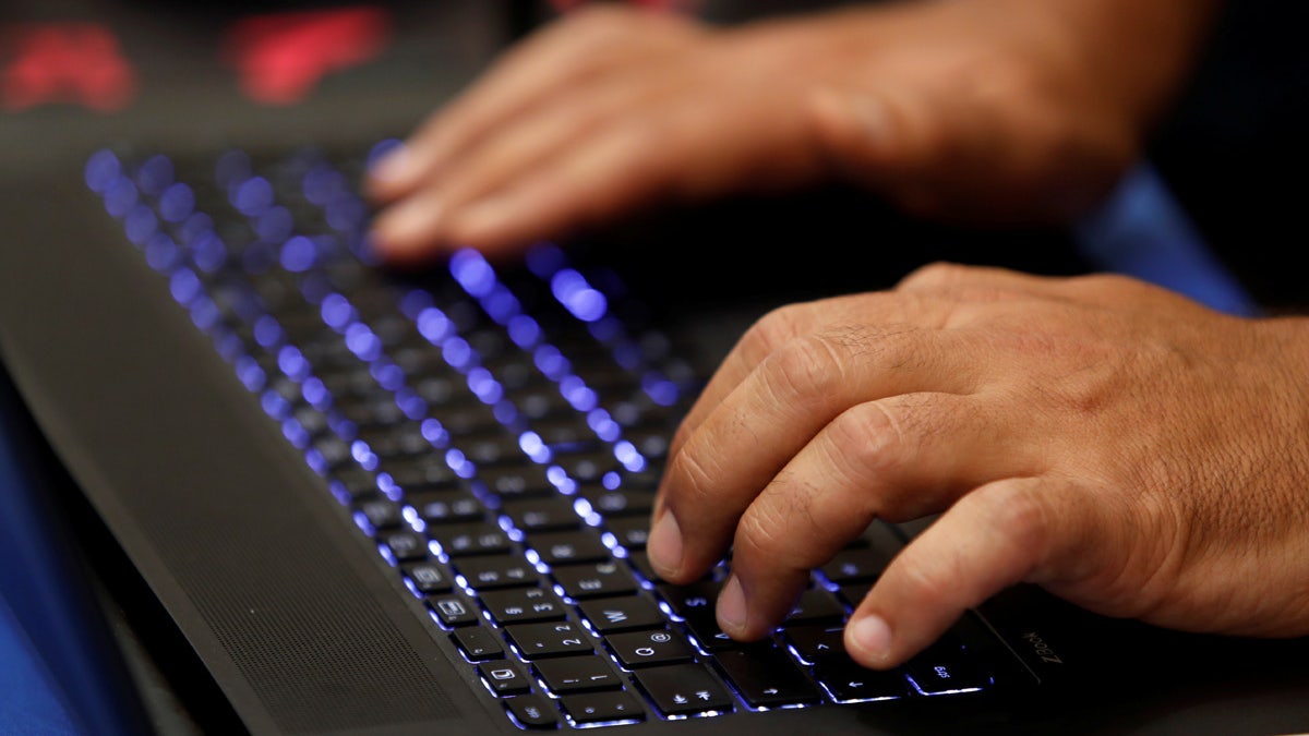 A man types into a keyboard during the Def Con hacker convention in Las Vegas, Nevada, U.S. on July 29, 2017. REUTERS/Steve Marcus - RC18F20EB340