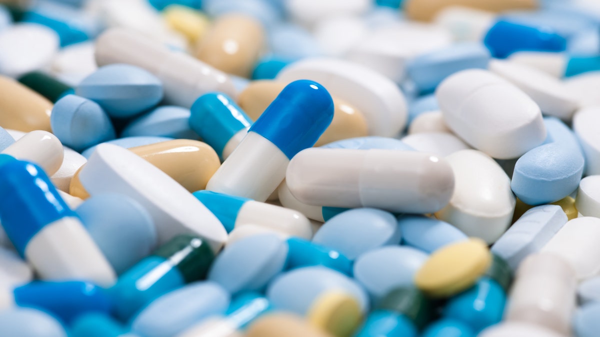 Heap of medicine pills. Close up of colorful tablets and capsules