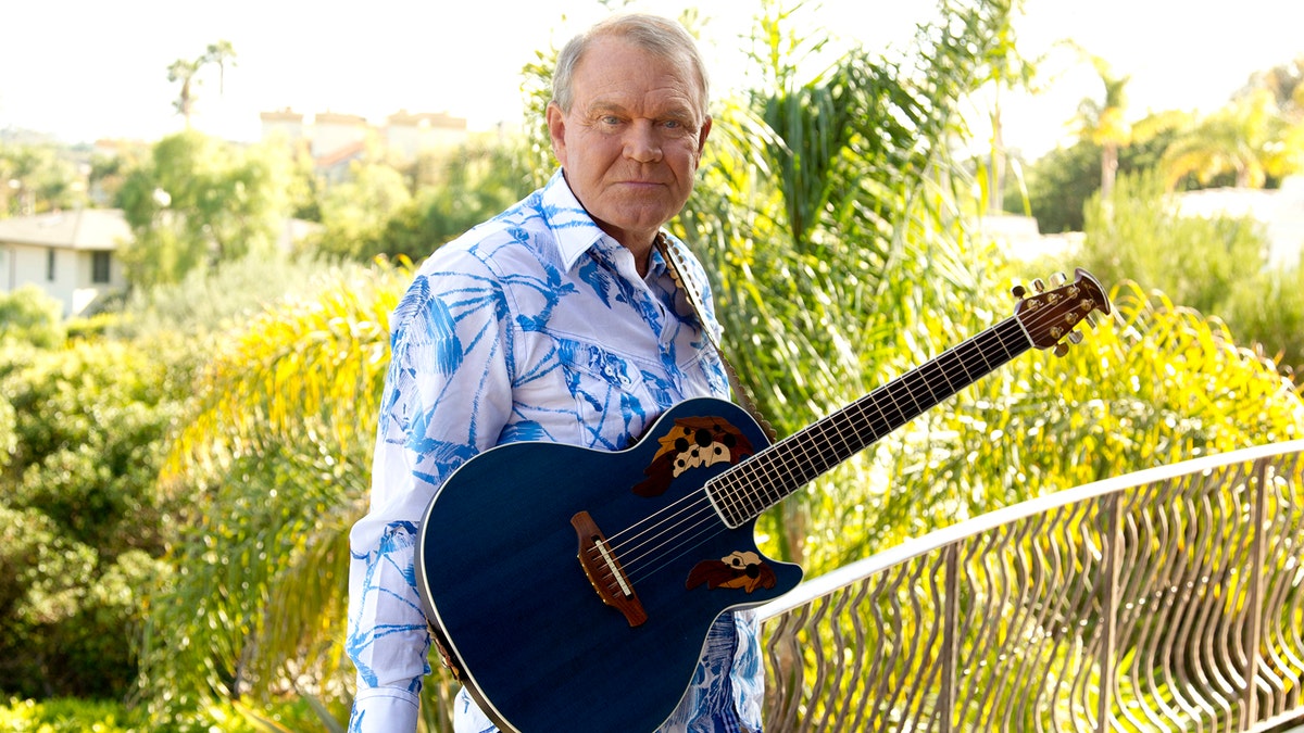 FILE - In this July 27, 2011 photo, musician Glen Campbell poses for a portrait in Malibu, Calif. Campbell, the grinning, high-pitched entertainer who had such hits as 