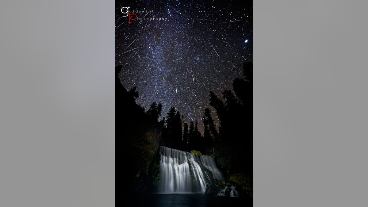 File photo: Photographer Brad Goldpaint captured this spectacular view of the Orionid meteor shower over Middle Falls outside the city of McCloud, Calif., near Mount Shasta in 2011.