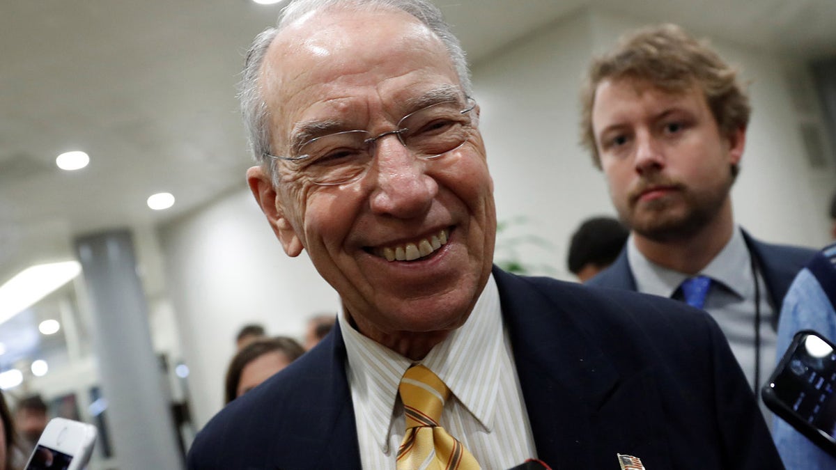 Sen. Chuck Grassley (R-IA) speaks with reporters ahead of the party luncheons on Capitol Hill in Washington, U.S. November 14, 2017. REUTERS/Aaron P. Bernstein - RC173F1C2CC0