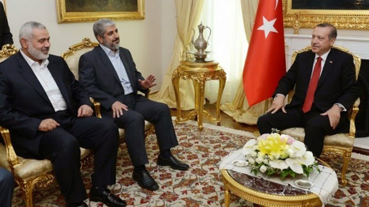 Turkish President Recep Tayyip Erdogan is shown here hosting Hamas leaders Khaled Mashaal and Ismail Haniyeh in June, 2013. Since this meeting Turkey's ties to Hamas have increased. [Turkish Prime Minister's Press Office]
