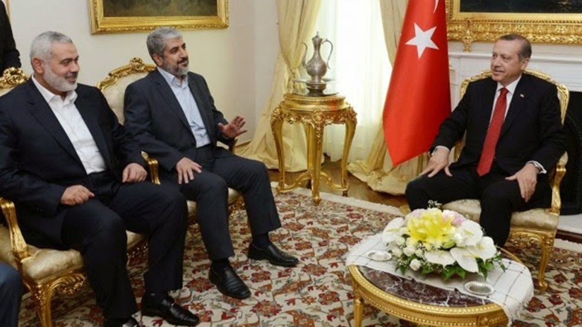 Turkish President Recep Tayyip Erdogan is shown here hosting Hamas leaders Khaled Mashaal and Ismail Haniyeh in June, 2013. Since this meeting Turkey's ties to Hamas have increased. [Turkish Prime Minister's Press Office]