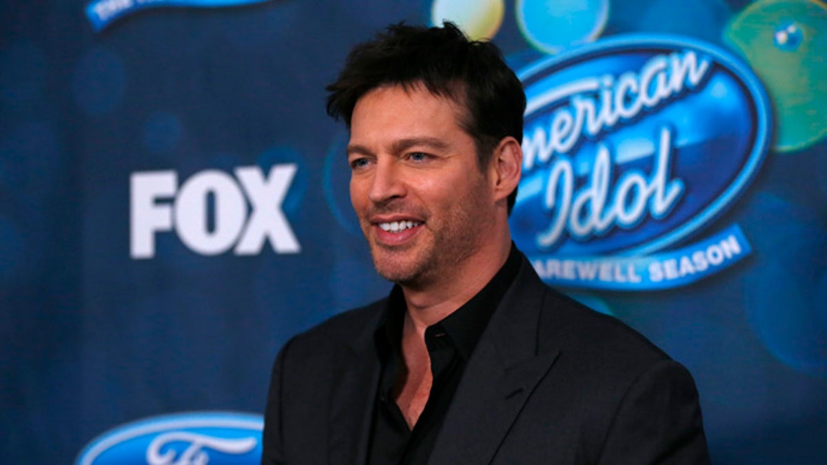 Singer and judge Harry Connick, Jr. poses at the party for the finalists of 