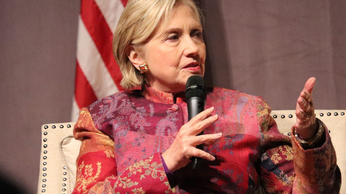 Former Secretary of State Hillary Clinton, accompanied by her husband former President Bill Clinton, speaks at a gathering in Little Rock, Ark., on Saturday, Nov. 18, 2017. The event marked 25 years since Bill Clinton was elected president. (AP Photo/Kelly P. Kissel)