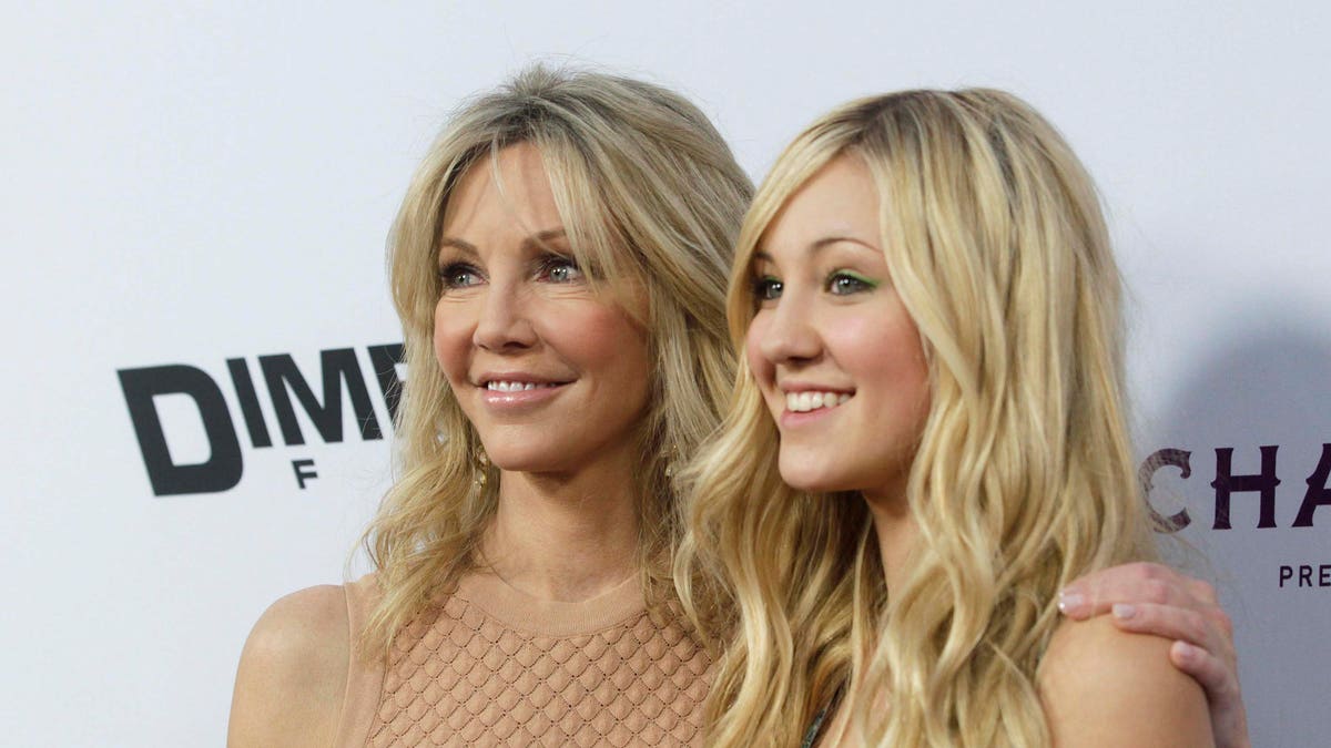 Actress Heather Locklear (L) and her daughter Ava Sambora arrive at the premiere of the film 