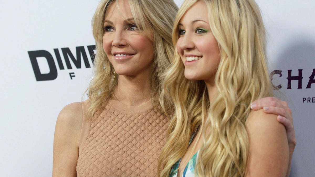 Actress Heather Locklear (L) and her daughter Ava Sambora arrive at the premiere of the film 