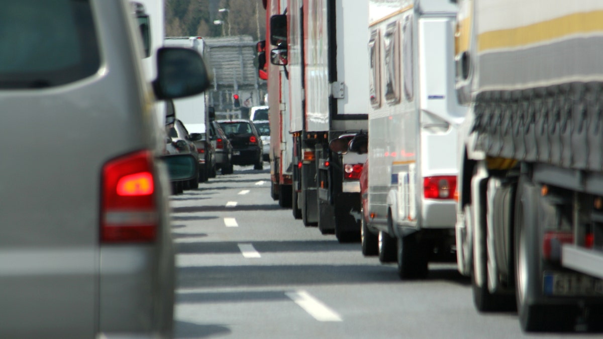 highway traffic jam with trucks istock