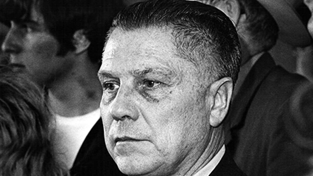 U.S. labour leader Jimmy Hoffa is photographed at the Greater Pittsburgh Airport, Pennsylvania in this April 12, 1971 file photograph. Hoffa was switching planes from San Francisco, and was returning to the federal prison in Allenwood, Pennsylvania. Hoffa was let out of prison to visit his wife, who had been hospitalized with heart problems. REUTERS