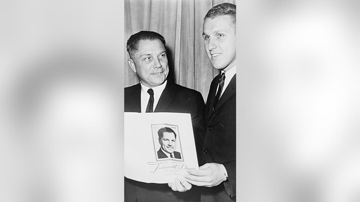 Labor leader James R. Hoffa (left) with his son, James P. Hoffa at testimonial dinner in 1965.  World Telegram & Sun photo by John Bottega/Library of Congress