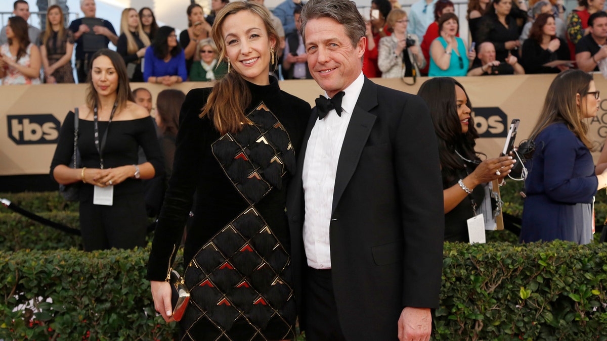Actor Hugh Grant and Anna Elisabet Eberstein arrive at the 23rd Screen Actors Guild Awards in Los Angeles, California, U.S., January 29, 2017.  REUTERS/Mario Anzuoni - HT1ED1U05UYHI