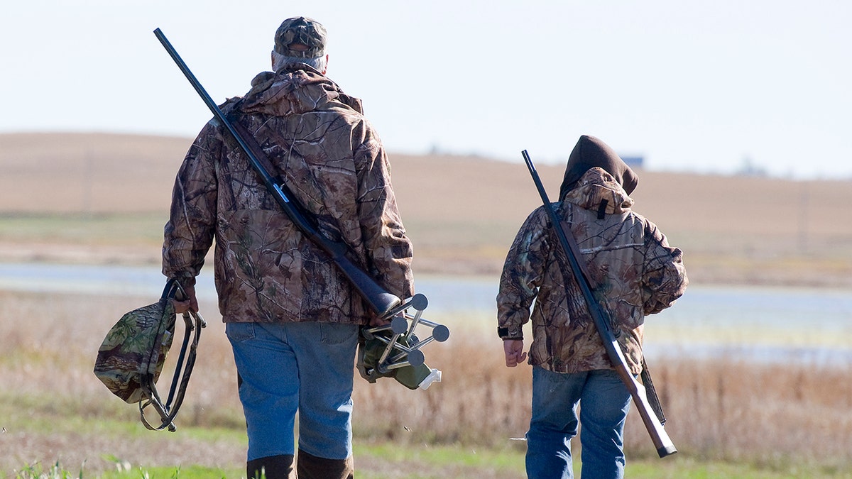 Grandpa and Grandson going duck hunting in North Dakota