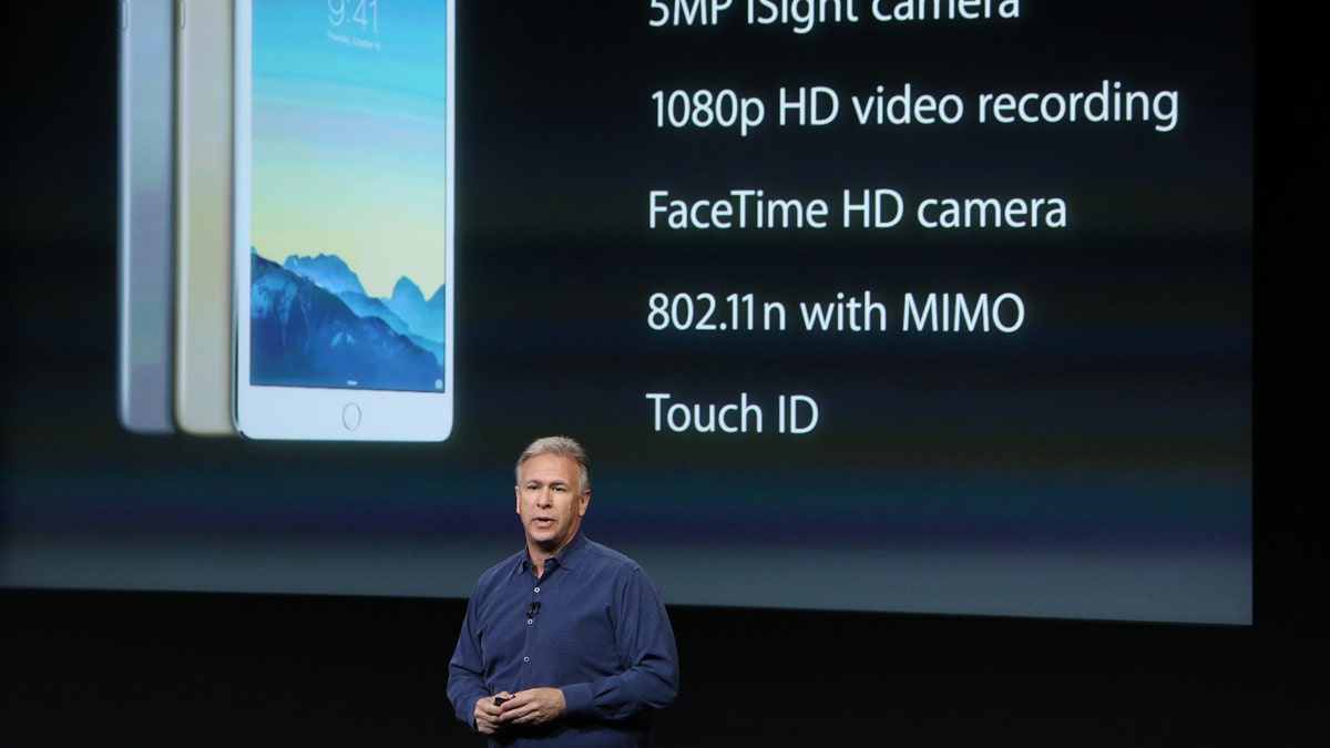 Phil Schiller, Apple's senior vice president of worldwide product marketing speaks during a presentation of the new iPad at Apple headquarters in Cupertino, Calif. Oct. 16, 2014.  