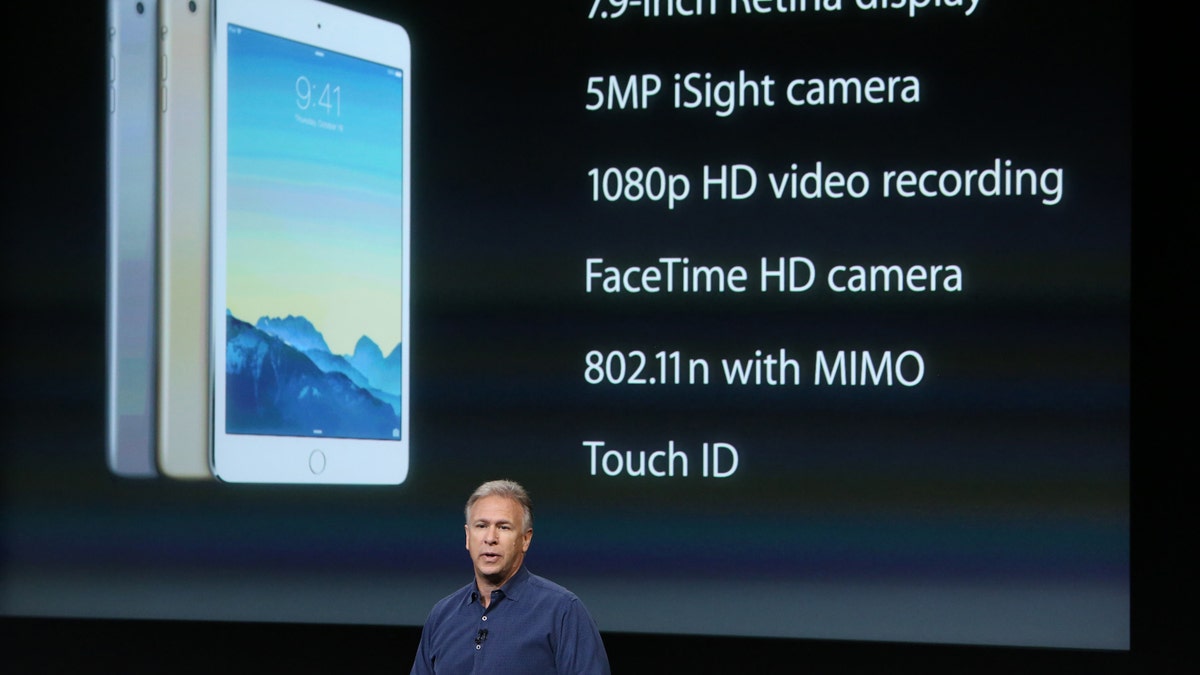 Phil Schiller, Apple's senior vice president of worldwide product marketing speaks during a presentation of the new iPad at Apple headquarters in Cupertino, Calif. Oct. 16, 2014.  