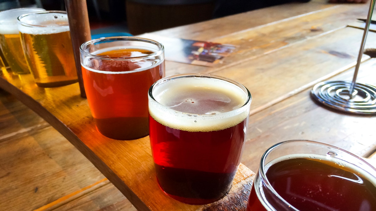 Craft beers are served together in a sampler tray for the beer enthusiast at a restaurant in Oregon.