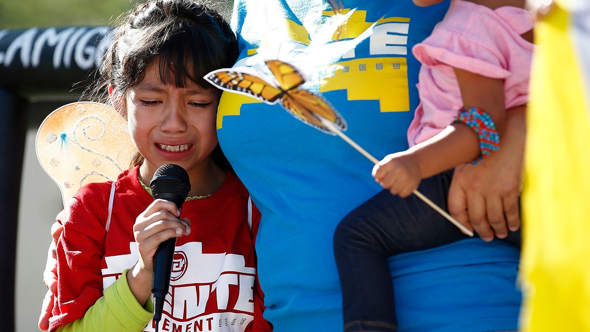 Akemi Vargas, 8, cries as she talks about being separated from her father during an immigration family separation protest in front of the Sandra Day O'Connor U.S. District Court building in Phoenix. Child welfare agencies across America make wrenching decisions every day to separate children from their parents. But those agencies have ways of minimizing the trauma that aren't being employed by the Trump administration at the Mexican border. 