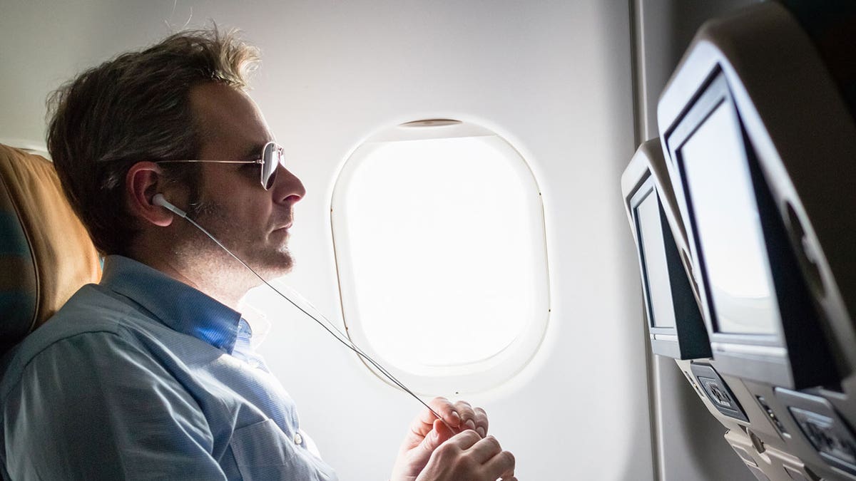 in-flight movie man istock