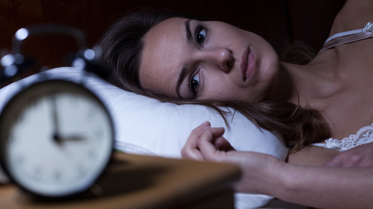 woman with insomnia sleep trouble istock large