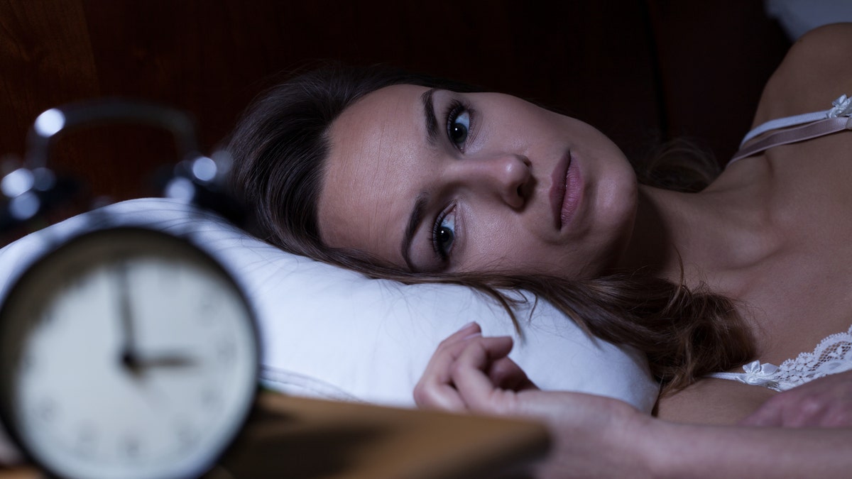 woman with insomnia sleep trouble istock large