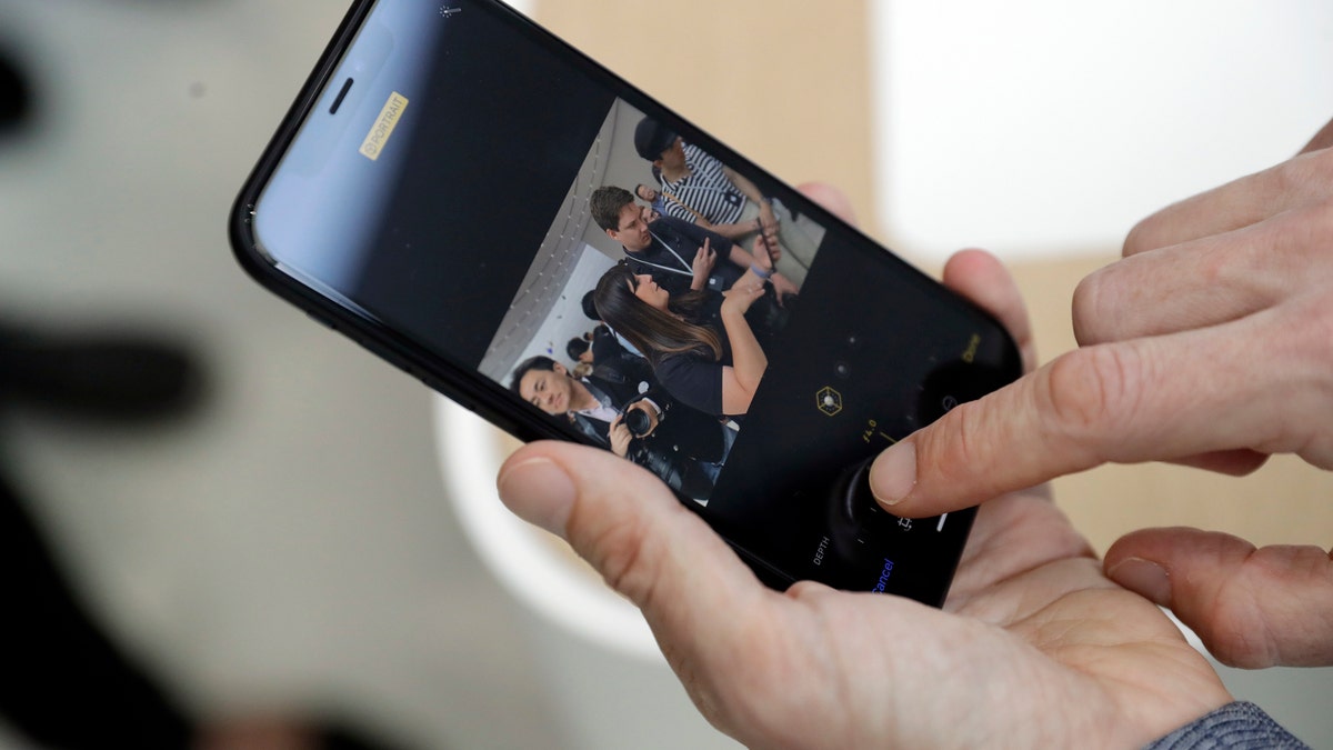 The new picture controls features are shown on an iPhone XR during an event to announce new products Wednesday, Sept. 12, 2018, in Cupertino, Calif. (AP Photo/Marcio Jose Sanchez)
