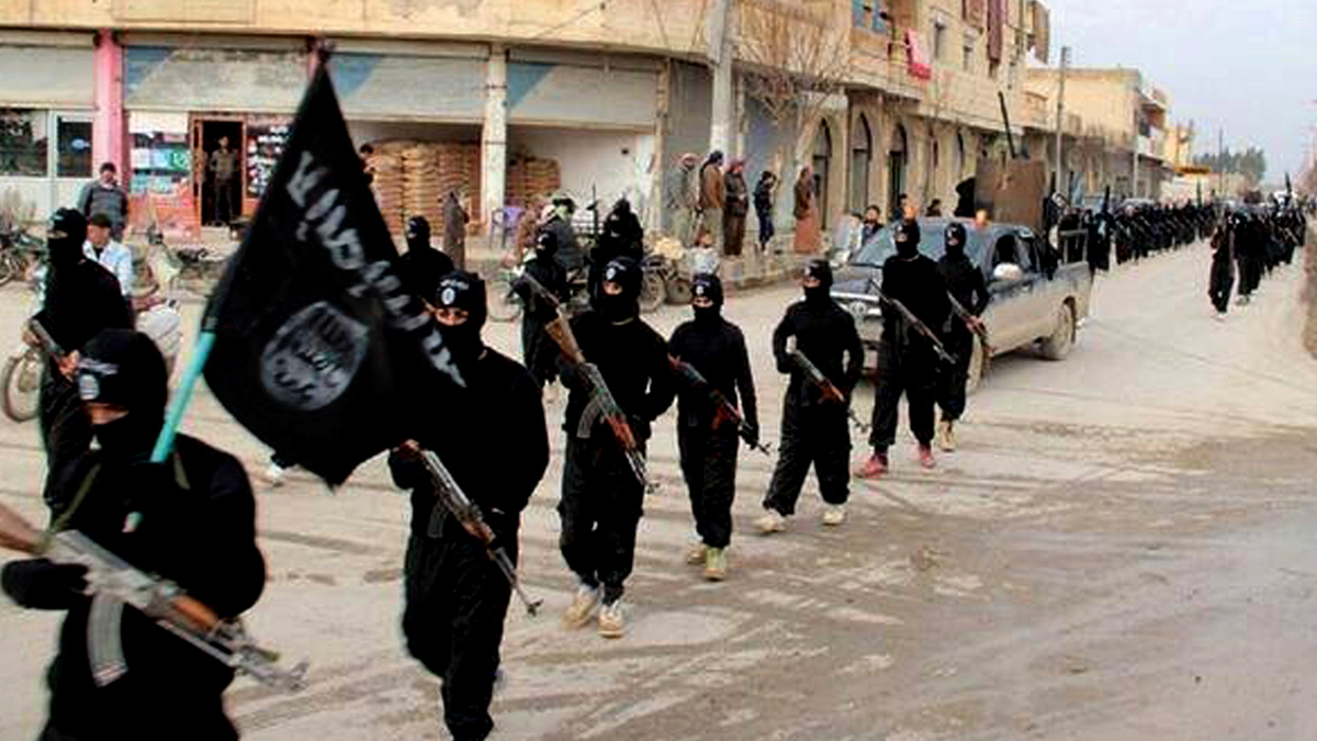 ISIS militants marching in Raqqa, Syria.