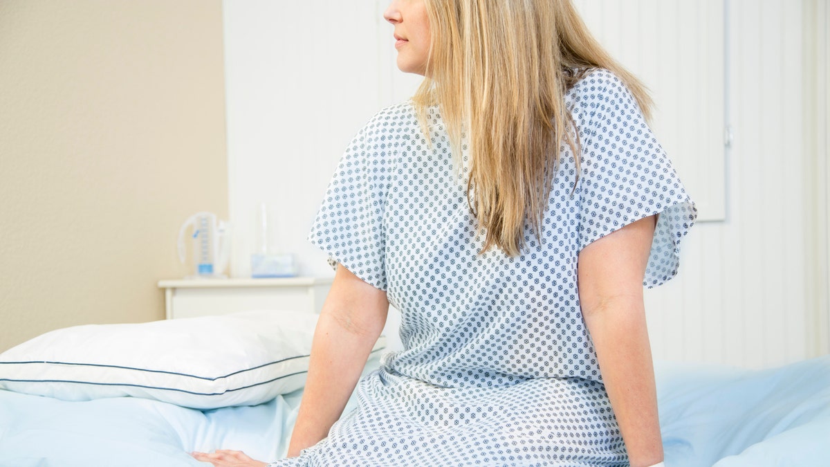 Mid-adult woman in gynecologist's office for her annual check up.  Women's health concept.